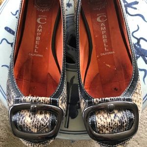 Flat snakeskin shoes with large pewter tone buckles